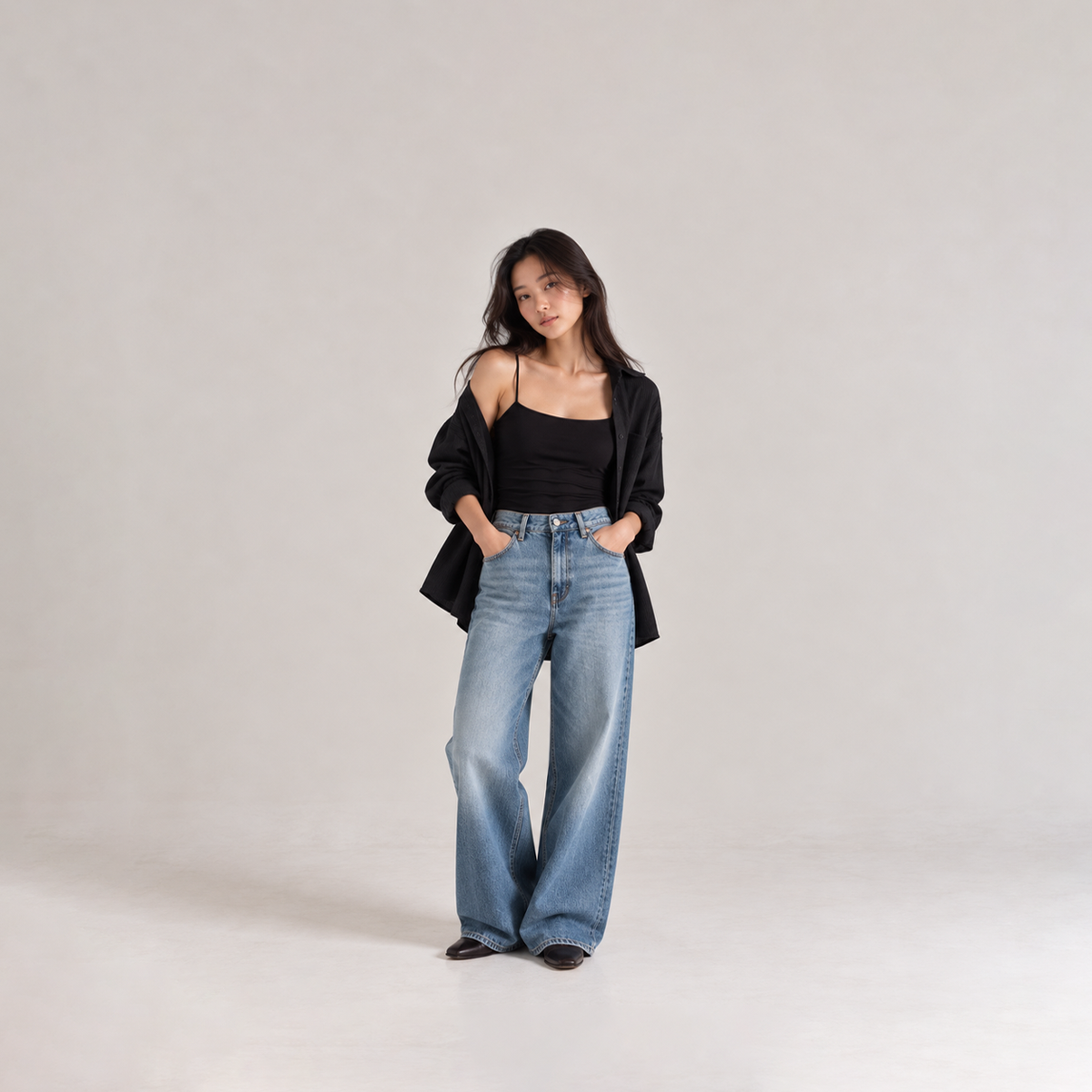 CLOUDÉ black TENCEL™ Modal Camisole styled with jeans for an effortless everyday look